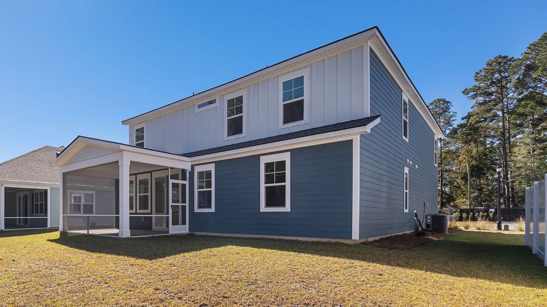 Exterior details and patio area of a home in Heron Pointe, Myrtle Beach (Image 4).