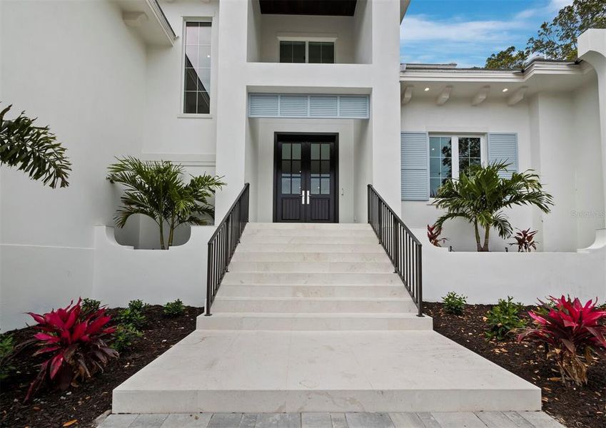 Front exterior of a new home in , Sarasota, FL, highlighting curb appeal (Image 23).