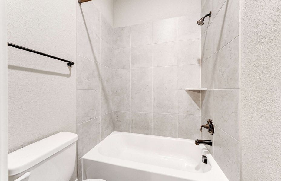 Representative furnished interior of a home built from the 4590 by Ravenna Homes in Artavia 70′, Conroe (Image 9).
