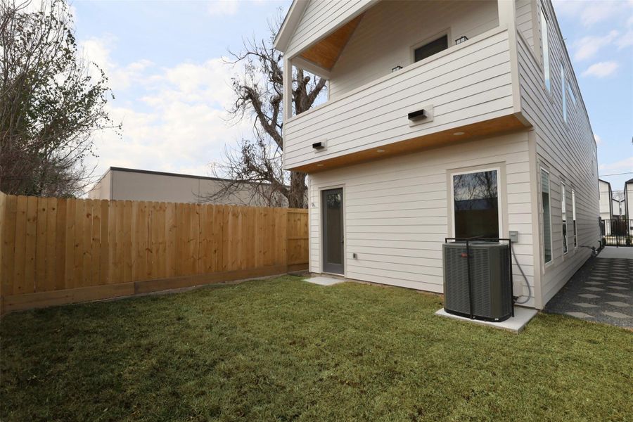 Expansive backyard offering ample space for entertaining or relaxation. TRANE AC unit. Expansive backyard offering ample space for entertaining or relaxation. TRANE AC unit.