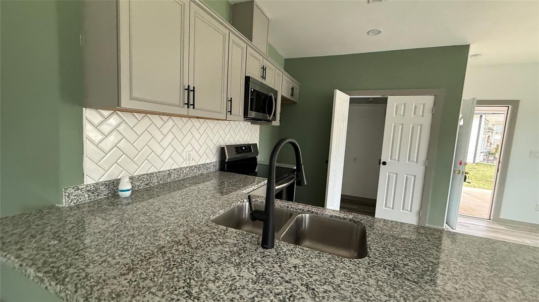 Furnished interior view inside a new home in , Conroe (Image 7).