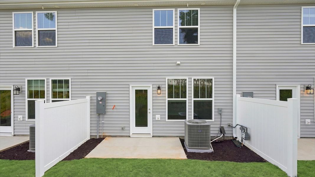 Accomplished rear exterior with a spacious patio that blends comfort and style located in Anderson, SC