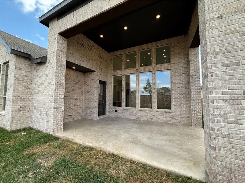 Exterior details and patio area of a home in Emory Glen, Magnolia (Image 2). Exterior details and patio area of a home in Emory Glen, Magnolia (Image 2).