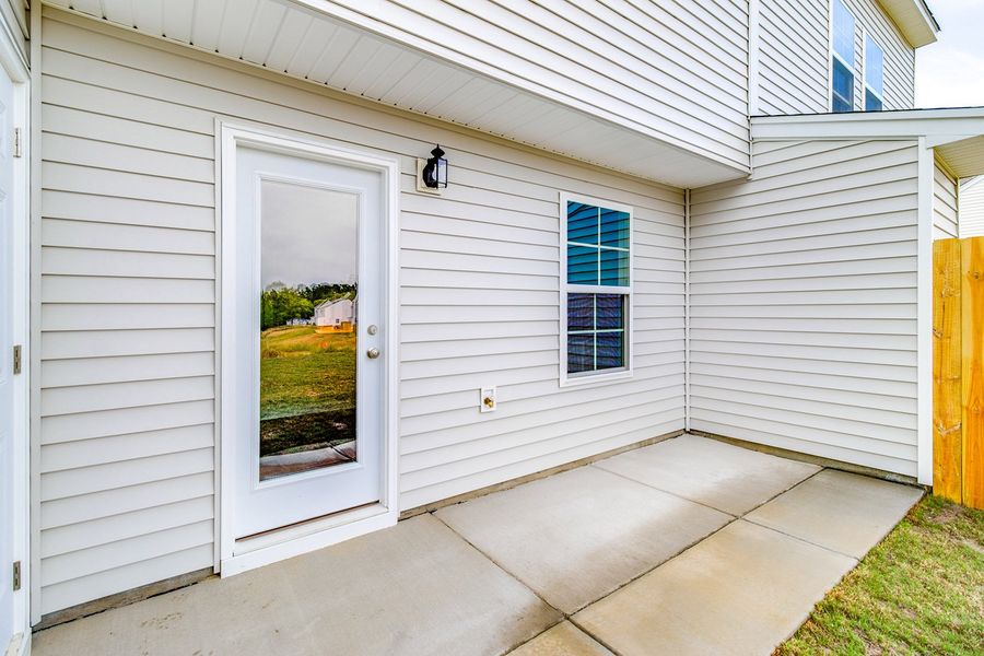 Exterior details and patio area of a home in Padgett Commons, Hopkins (Image 3).