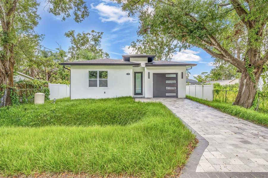 Front exterior of a new home in , Tampa, FL, highlighting curb appeal (Image 26).