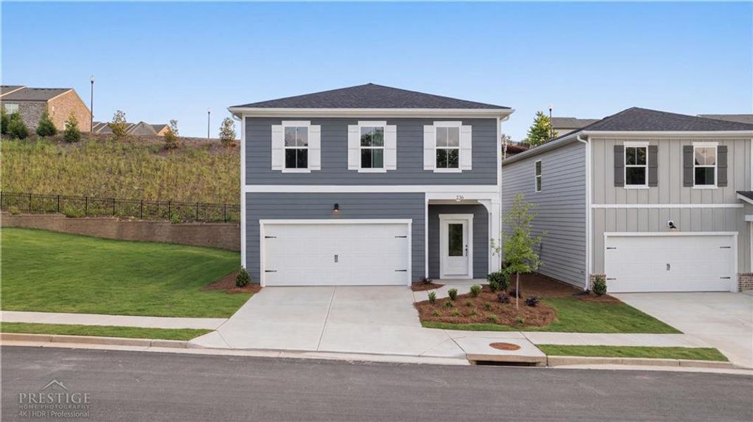 Front exterior of a new home in The Bluffs, Canton, GA, highlighting curb appeal (Image 2). Front exterior of a new home in The Bluffs, Canton, GA, highlighting curb appeal (Image 2).