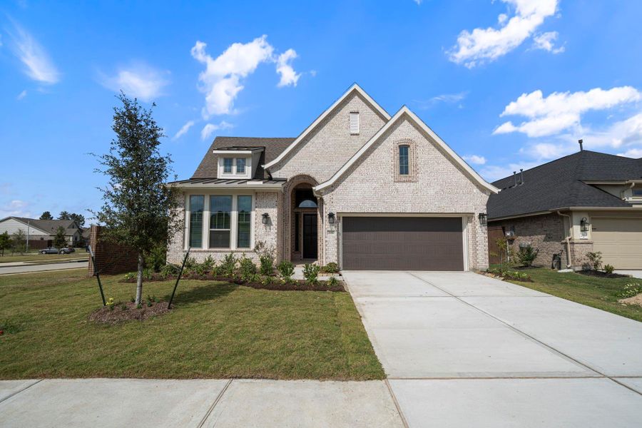 Front exterior of a new home in The Trails, New Caney, TX, highlighting curb appeal (Image 2). Front exterior of a new home in The Trails, New Caney, TX, highlighting curb appeal (Image 2).