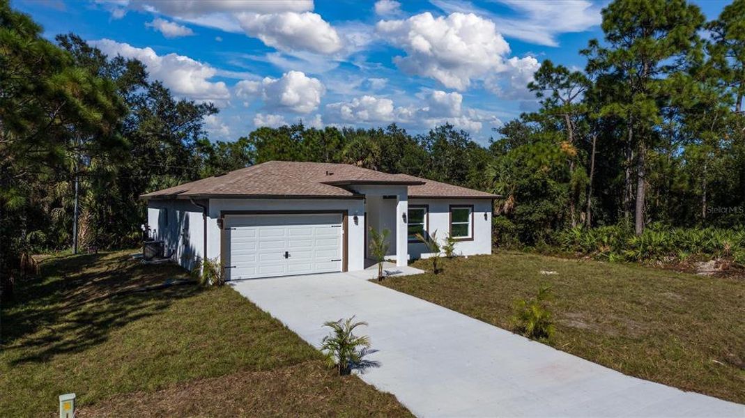 Front exterior of a new home in , Punta Gorda, FL, highlighting curb appeal (Image 26). Front exterior of a new home in , Punta Gorda, FL, highlighting curb appeal (Image 26).