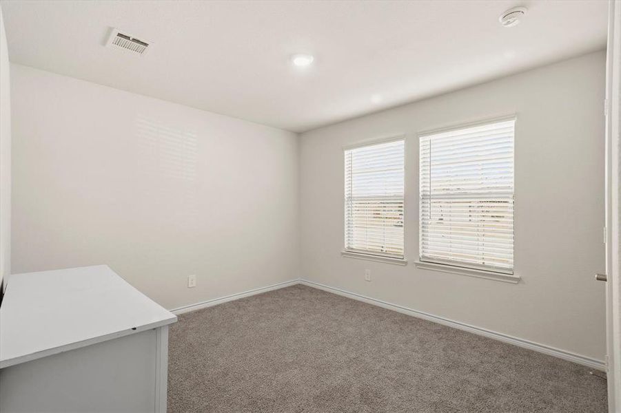 Carpeted Bedroom featuring baseboards Carpeted Bedroom featuring baseboards