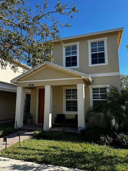 Front exterior of a new home in Aspire at East Lake, Port St. Lucie, FL, highlighting curb appeal (Image 2). Front exterior of a new home in Aspire at East Lake, Port St. Lucie, FL, highlighting curb appeal (Image 2).
