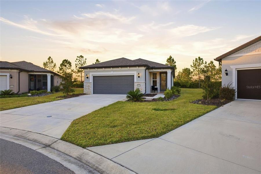 Front exterior of a new home in Del Webb Stone Creek, Ocala, FL, highlighting curb appeal (Image 21). Front exterior of a new home in Del Webb Stone Creek, Ocala, FL, highlighting curb appeal (Image 21).