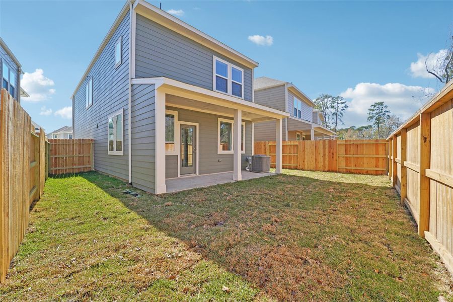 Exterior details and patio area of a home in Pinewood Trails - City Series, Atascocita (Image 21).