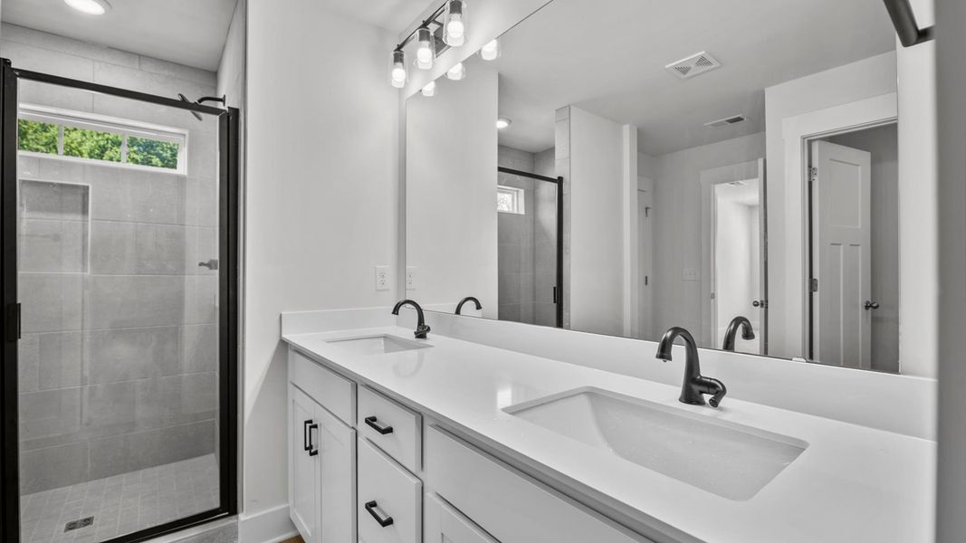 Representative furnished interior of a home built from the Jasmine by DRB Homes in Harrier Point, Woodruff (Image 25).