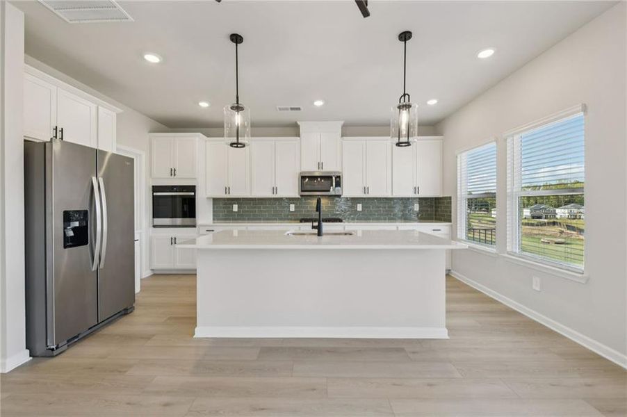 Furnished interior view inside a new home in Vines at Mill Creek - Estate Series, Braselton (Image 11). Furnished interior view inside a new home in Vines at Mill Creek - Estate Series, Braselton (Image 11).