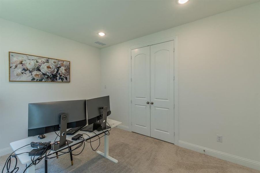 Room featuring neutral tone carpeting and white walls