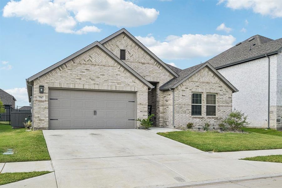 Front exterior of a new home in , Venus, TX, highlighting curb appeal (Image 22).