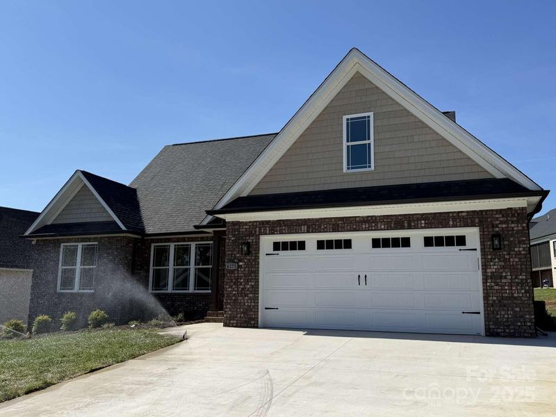 Front exterior of a new home in , Conover, NC, highlighting curb appeal (Image 1).