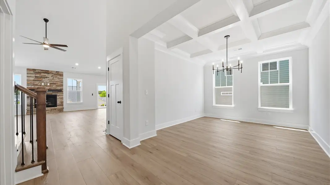 Desirable dining room with coffered ceiling and modern elegance in an established community in Moore, SC