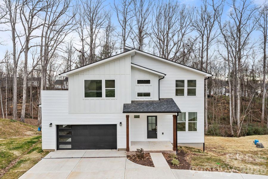 Front exterior of a new home in , Mooresville, NC, highlighting curb appeal (Image 1). Front exterior of a new home in , Mooresville, NC, highlighting curb appeal (Image 1).