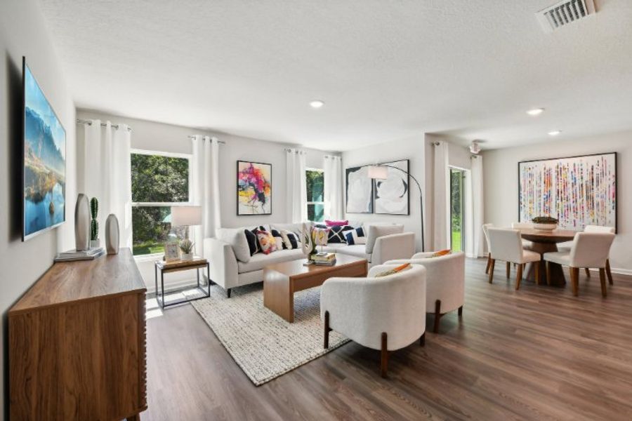 A living room with a wood floor.
