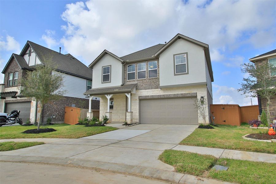 Front exterior of a new home in Cypress Green, Hockley, TX, highlighting curb appeal (Image 2). Front exterior of a new home in Cypress Green, Hockley, TX, highlighting curb appeal (Image 2).