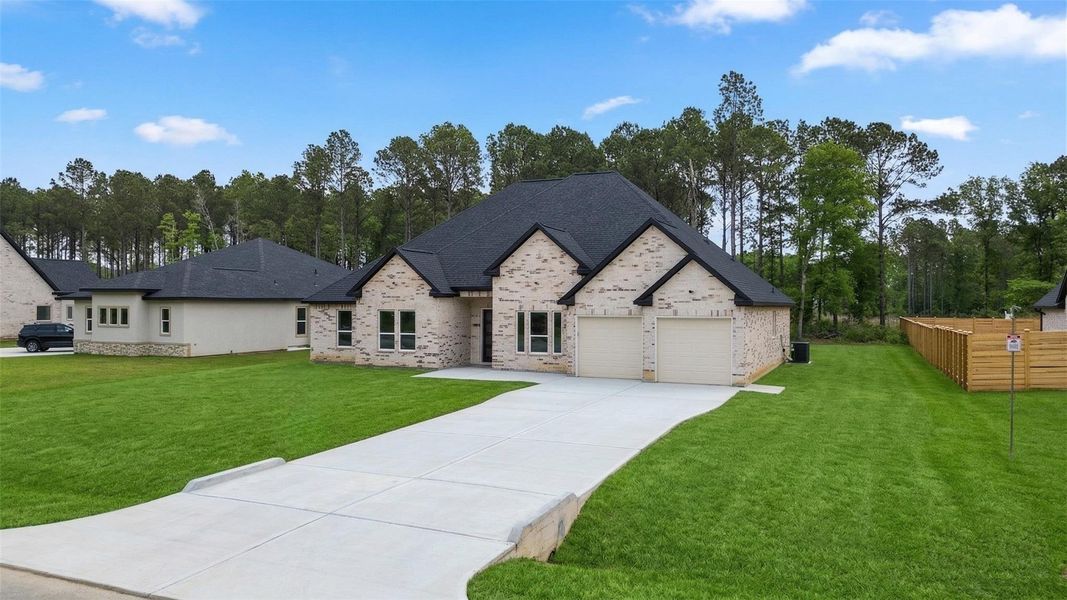 Front exterior of a new home in , Dayton, TX, highlighting curb appeal (Image 1). Front exterior of a new home in , Dayton, TX, highlighting curb appeal (Image 1).