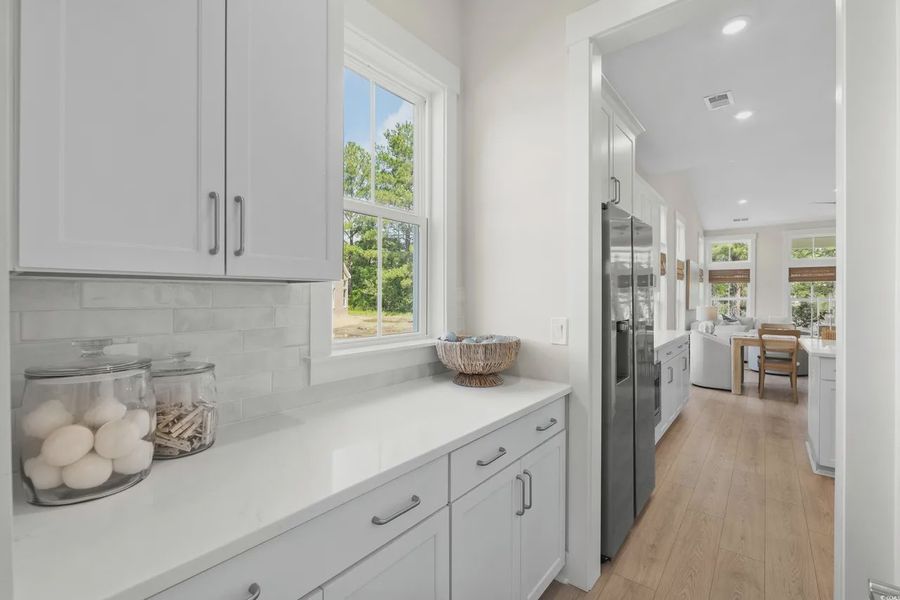 Furnished interior view inside a new home in Long Bay Golf Club, Longs (Image 9).