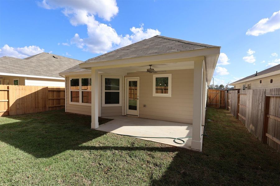 Exterior details and patio area of a home in Pinewood at Grand Texas, New Caney (Image 4).