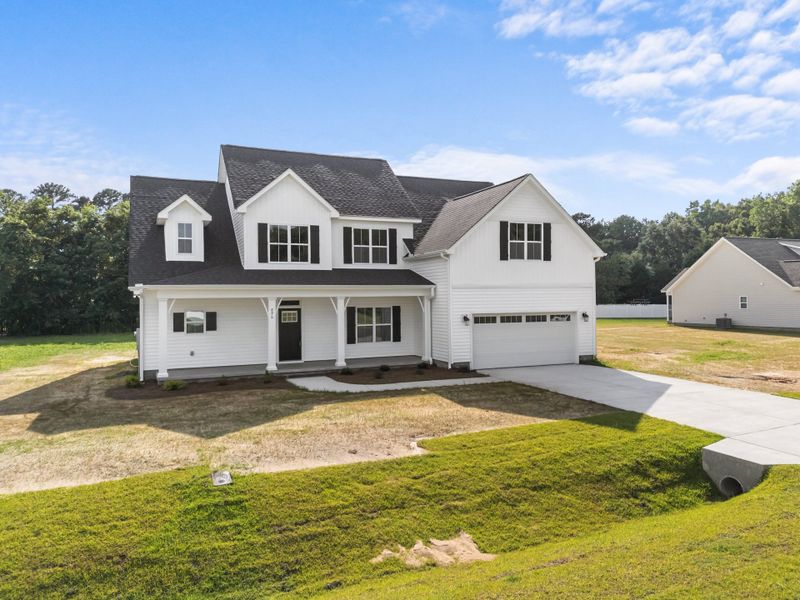 Front exterior of a home in the Kennedy's Crossing community, located in Grimesland, NC (Image 9).