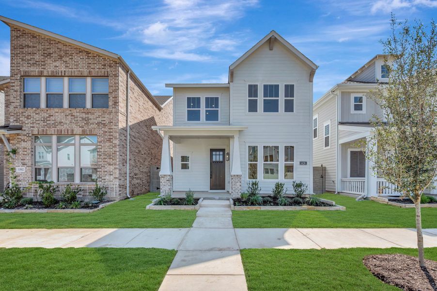 Front exterior of a new home in The Retreat at Harvest, Argyle, TX, highlighting curb appeal (Image 2). Front exterior of a new home in The Retreat at Harvest, Argyle, TX, highlighting curb appeal (Image 2).