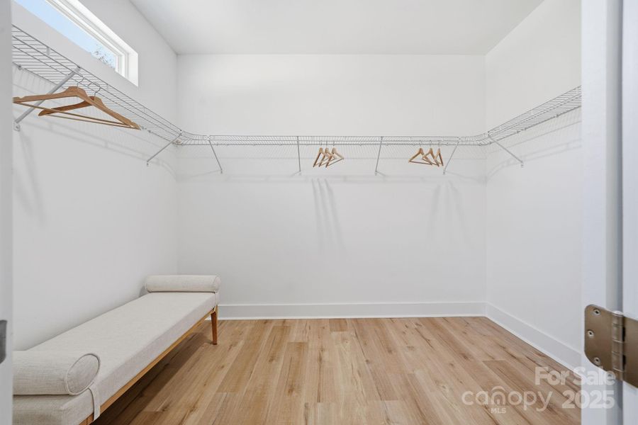 Primary Bedroom's Walk-in Closet Primary Bedroom's Walk-in Closet