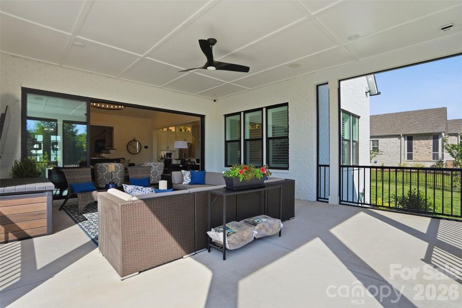 Covered, screened porch that opens into great room