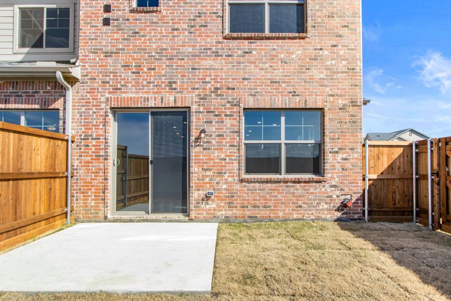 Exterior details and patio area of a home in Wildridge, Oak Point (Image 4).