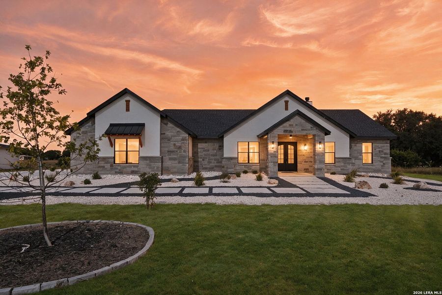 Front exterior of a new home in , Bandera, TX, highlighting curb appeal (Image 27).