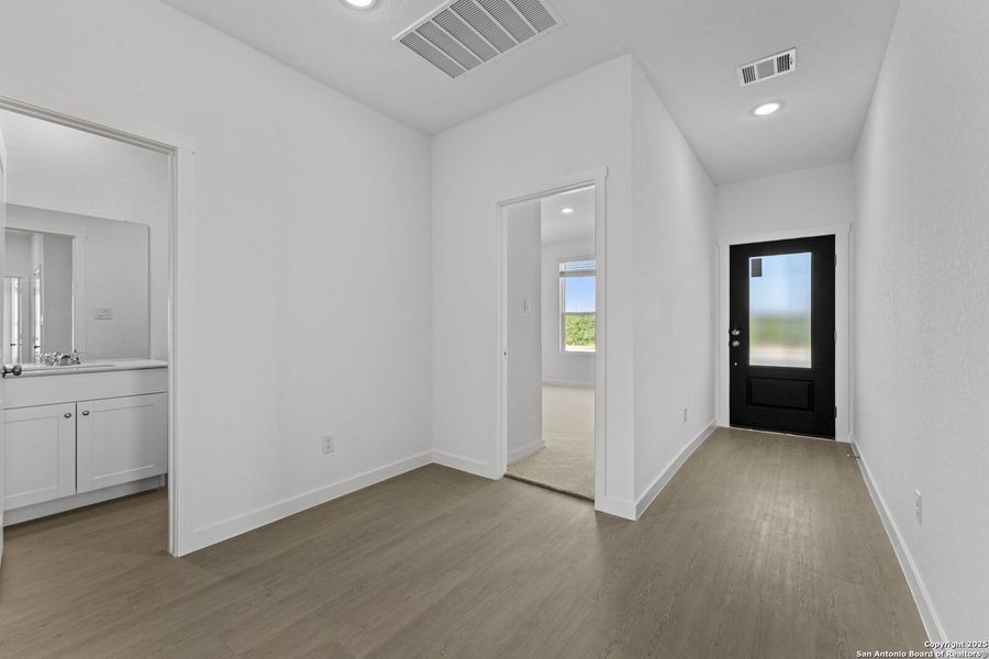 Spacious, unfurnished interior of a new home in Waterwheel: Coastline Collection, San Antonio (Image 25).