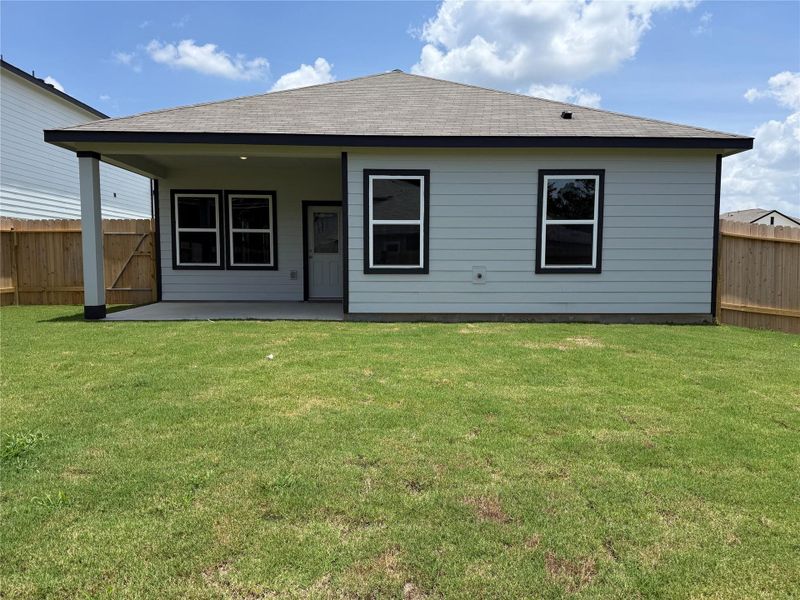Exterior details and patio area of a home in Spring Creek Trails, Magnolia (Image 3).