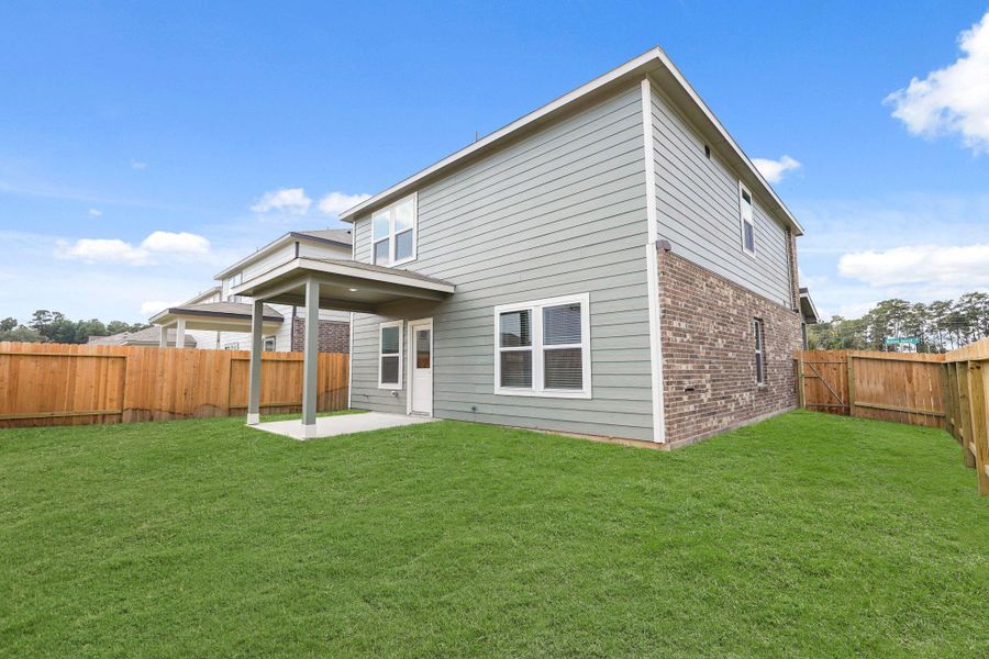 Exterior details and patio area of a home in Lakes at Black Oak, Magnolia (Image 4).