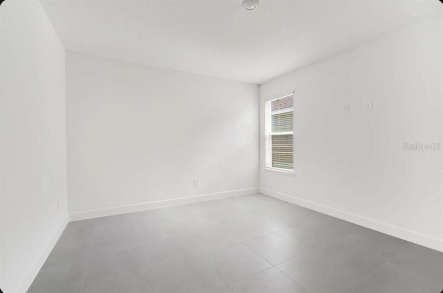 Spacious, unfurnished interior of a new home in Harvest at Ovation, Winter Garden (Image 6).