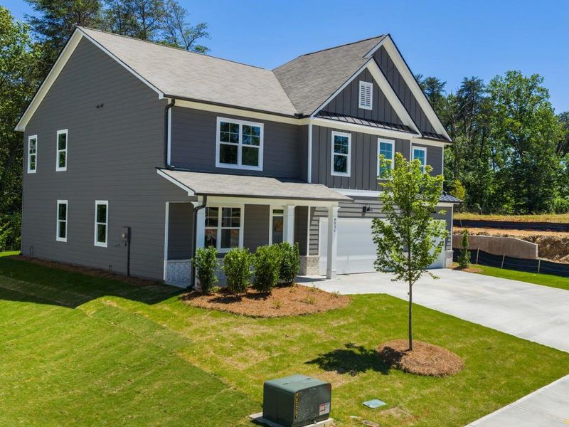 Front exterior of a new home in Falcon Landing, Gainesville, GA, highlighting curb appeal (Image 20).