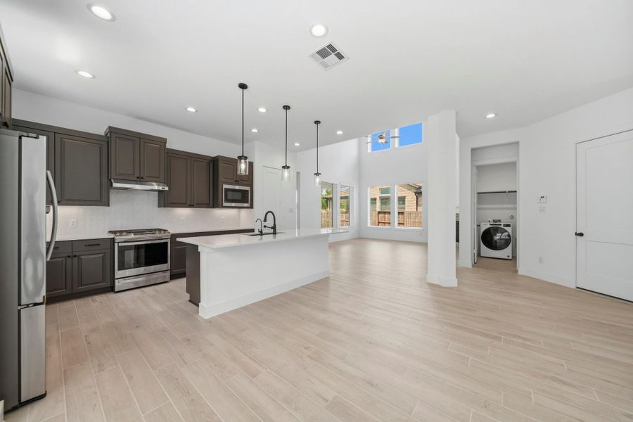 This kitchen conveniently connects to the dining area and living room for easy entertaining!