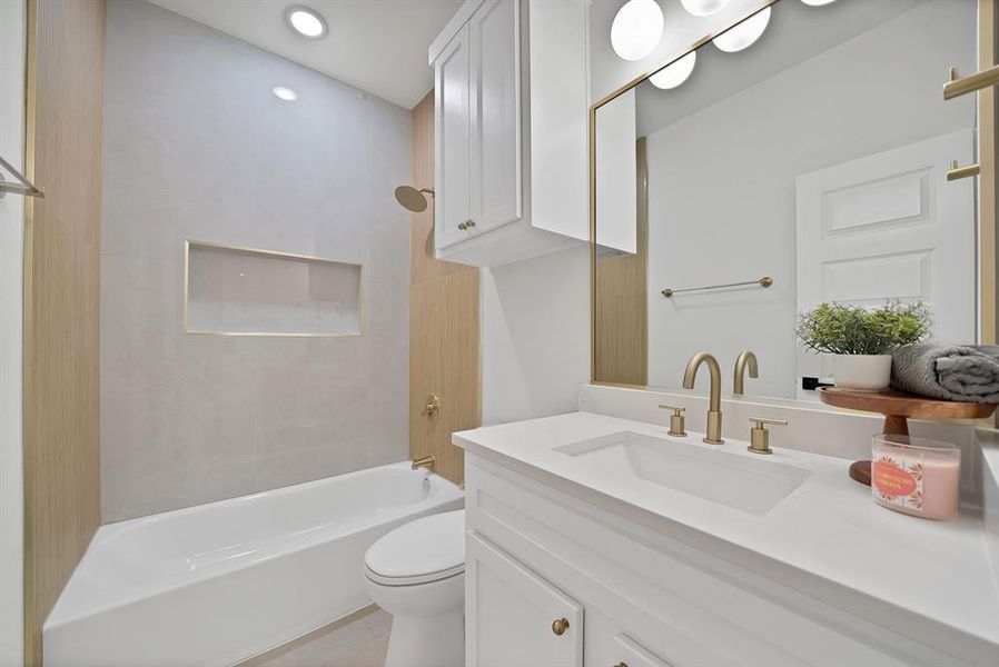Full bathroom featuring vanity, shower / washtub combination, and recessed lighting Full bathroom featuring vanity, shower / washtub combination, and recessed lighting