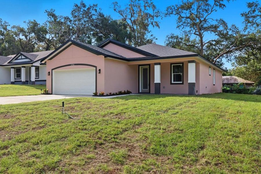 Front exterior of a new home in , Inverness, FL, highlighting curb appeal (Image 22).