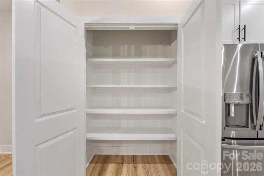 Large Pantry with Upgraded Shelving.