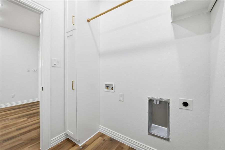 Laundry area featuring dark wood-style floors, hookup for a washing machine, and electric dryer hookup