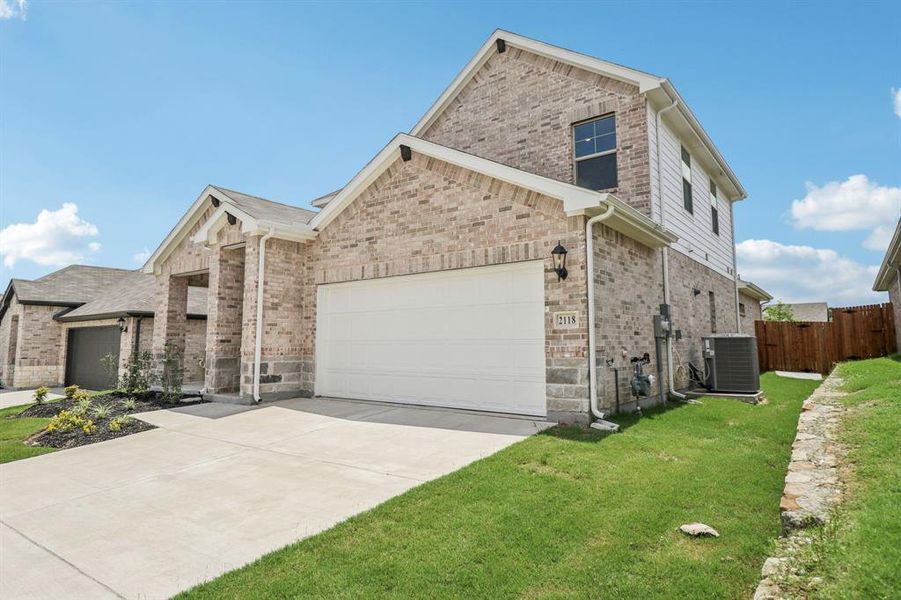 Front exterior of a new home in Westmoor, Sherman, TX, highlighting curb appeal (Image 16).