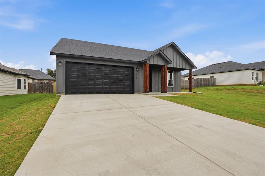 Front exterior of a new home in , Granbury, TX, highlighting curb appeal (Image 18).