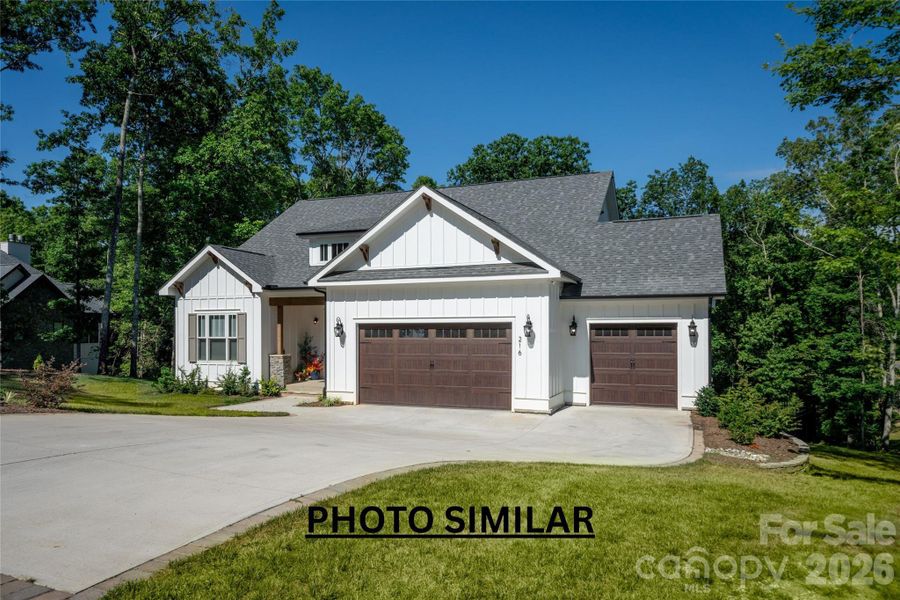 Front exterior of a new home in , Hendersonville, NC, highlighting curb appeal (Image 2). Front exterior of a new home in , Hendersonville, NC, highlighting curb appeal (Image 2).