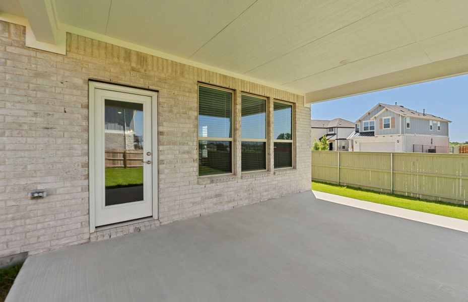 Exterior details and patio area of a home in Santa Rita Ranch, Liberty Hill (Image 27).