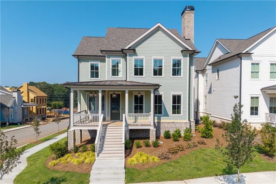 Front exterior of a new home in Crossroads, Milton, GA, highlighting curb appeal (Image 25). Front exterior of a new home in Crossroads, Milton, GA, highlighting curb appeal (Image 25).