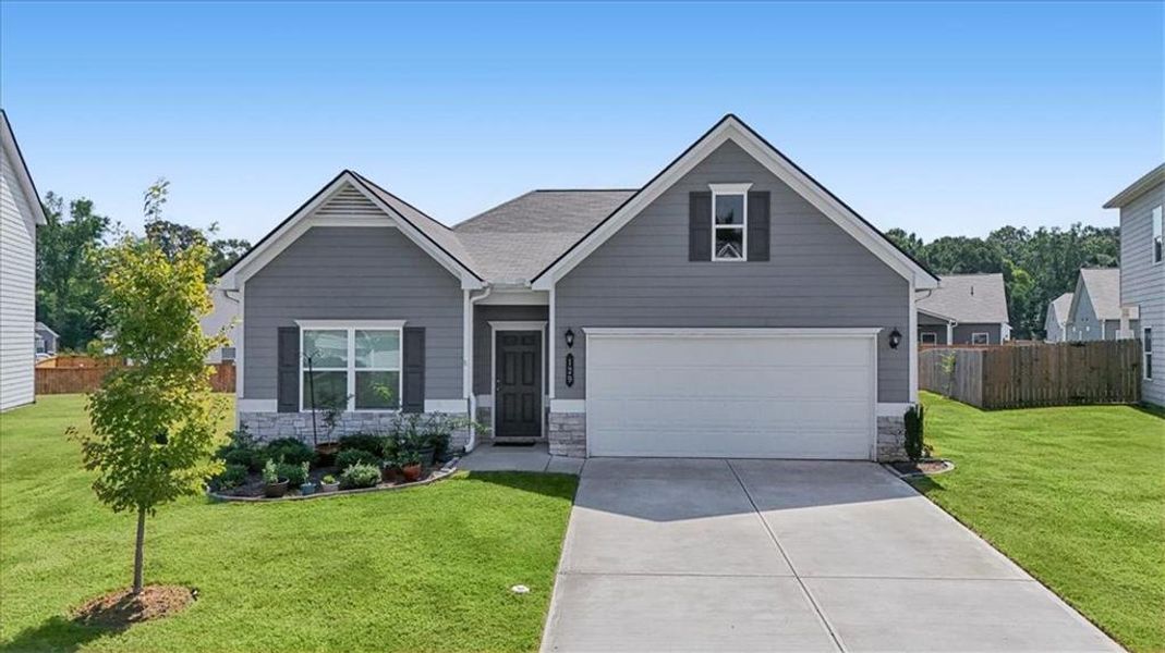 Front exterior of a new home in , Cartersville, GA, highlighting curb appeal (Image 24).